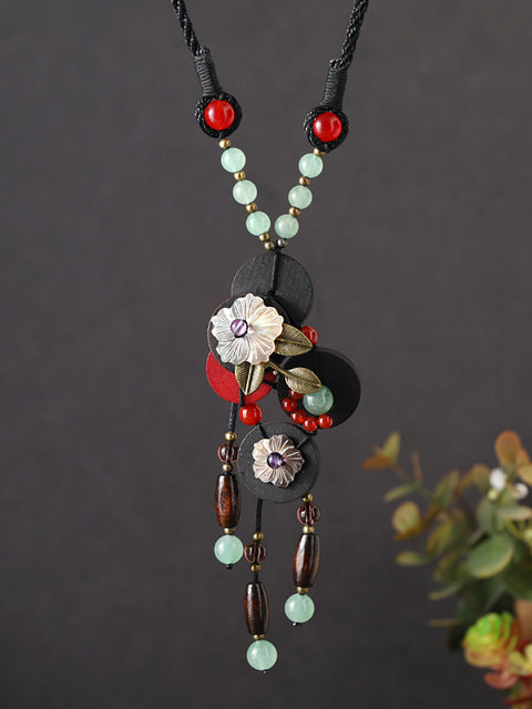 Collier ethnique en alliage de bois avec pendentif en forme de fleur et pompon pour femme